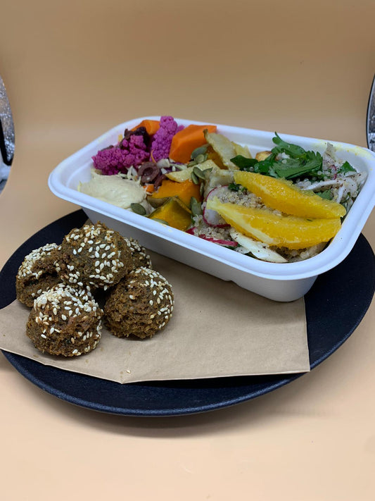 Falafel box with salad, baba ganoush & pickles.