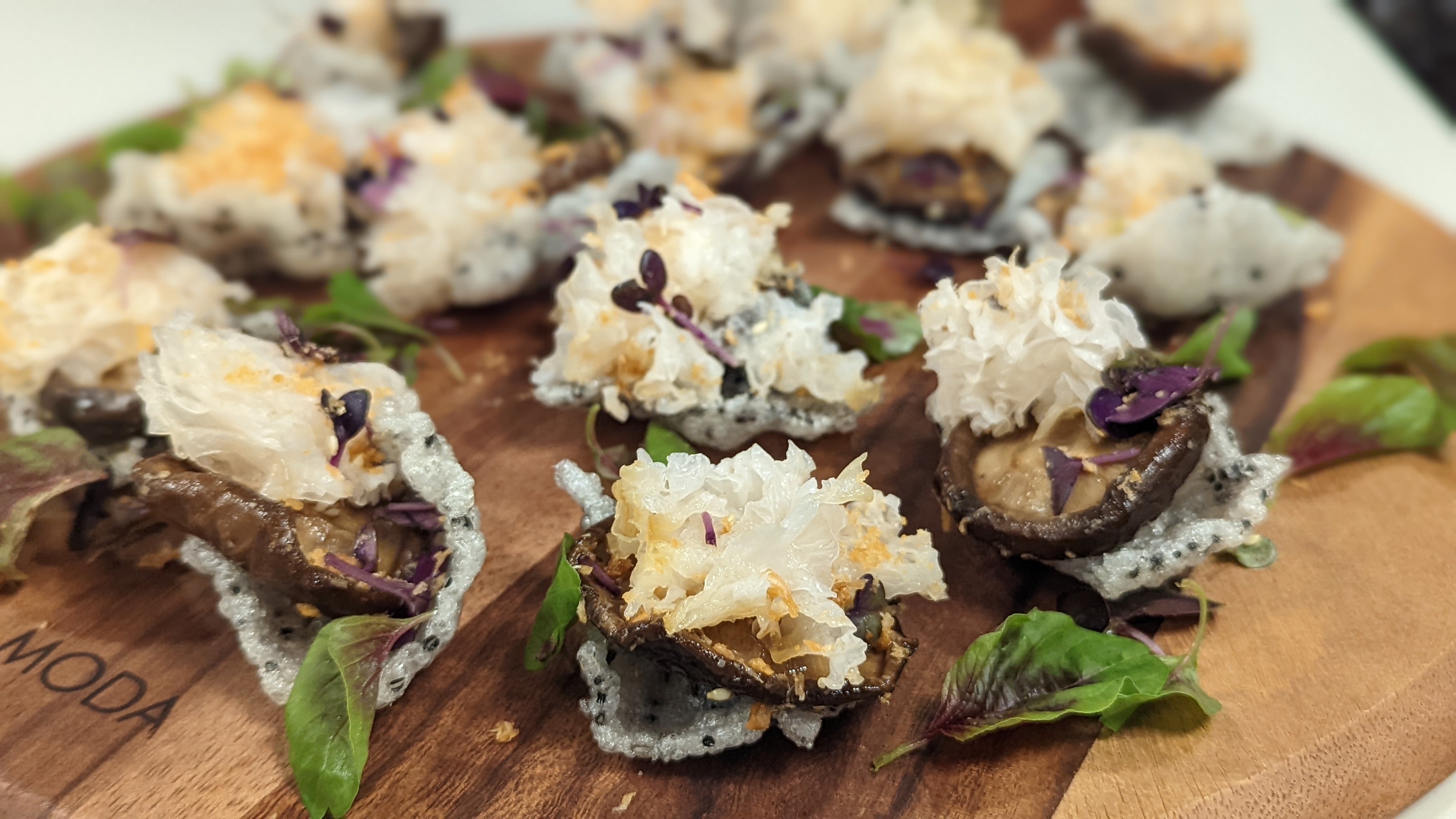 confit ottway shiitake, white fugus, mushroom floss on a sesame rice cracker. A perfect umami bomb that is both vegan & gluten free.