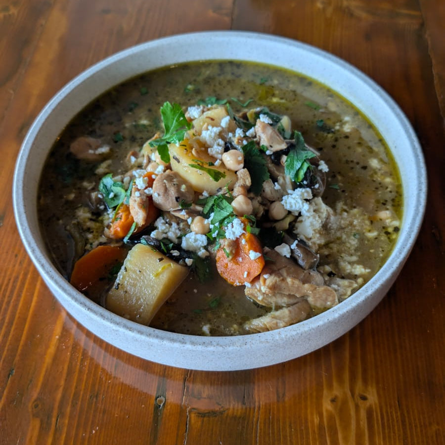  bowl of soup on a wooden table